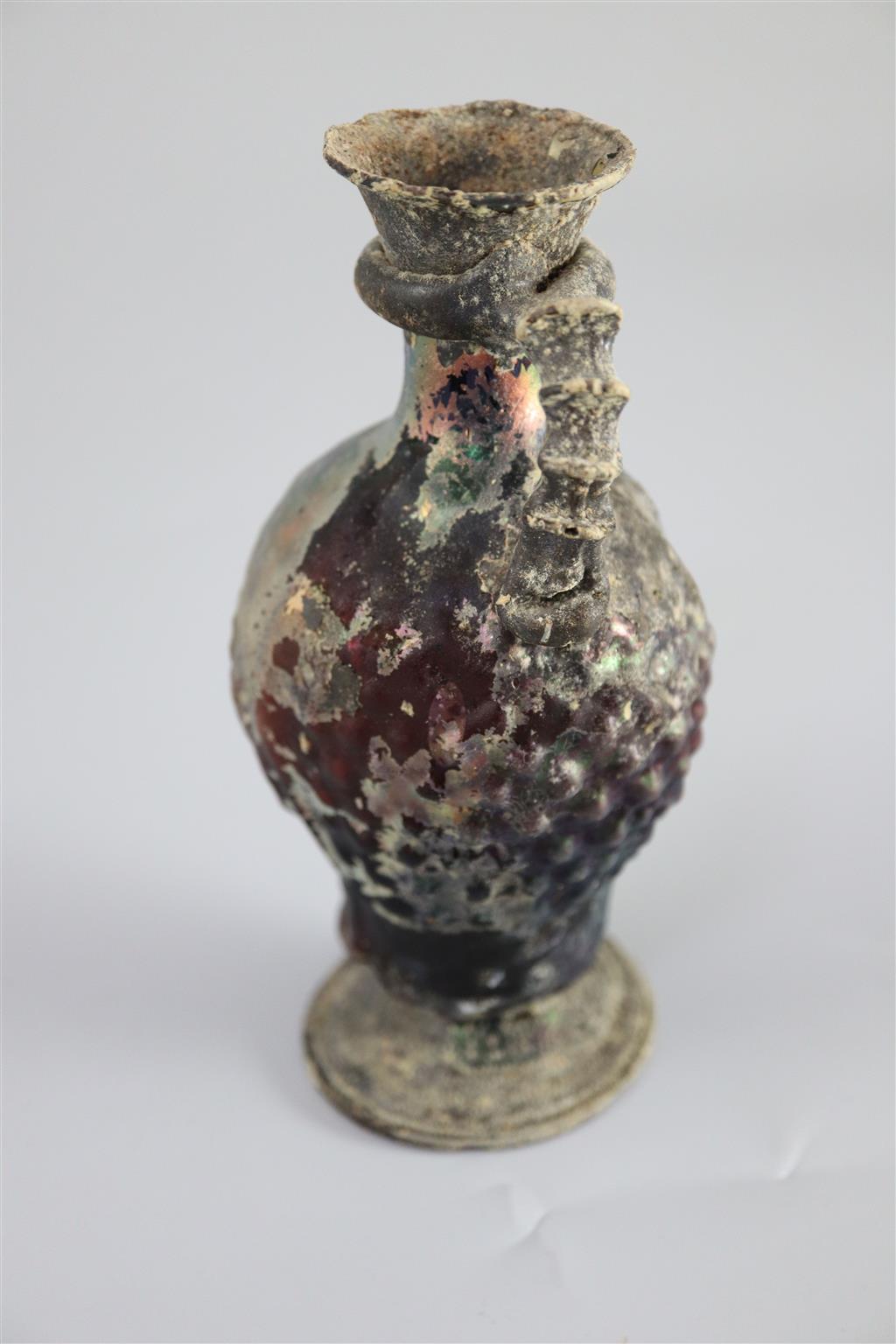 A Roman amethyst glass ewer, 1st/2nd century AD, 15.2cm high